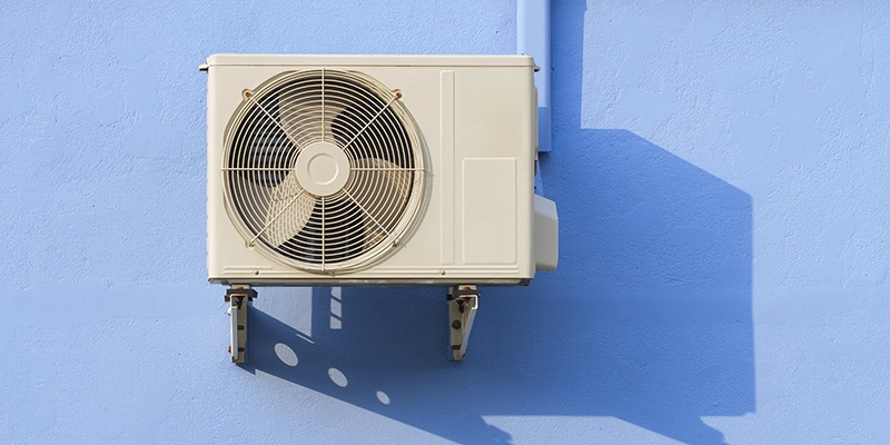 ac unit rattling - 5 Reasons Why Your AC Unit is Rattling - air conditioner on outside blue wall