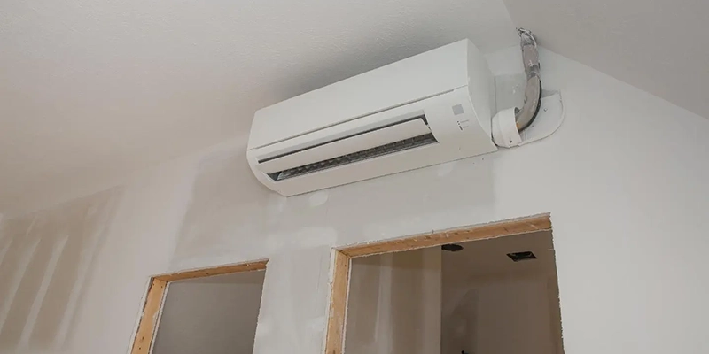 ductless - How Do Ductless Air Conditioners Work - room under construction air conditioner mounted above door frames