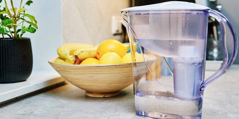 homemade water filtration - Choosing the Right Product - a bowl of lemons next to a pitcher of water with filter