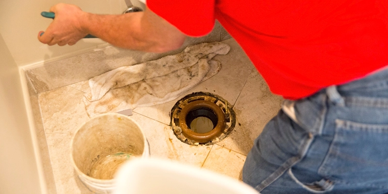 leak detection - Toilet Leaks - plumber repairing toilet