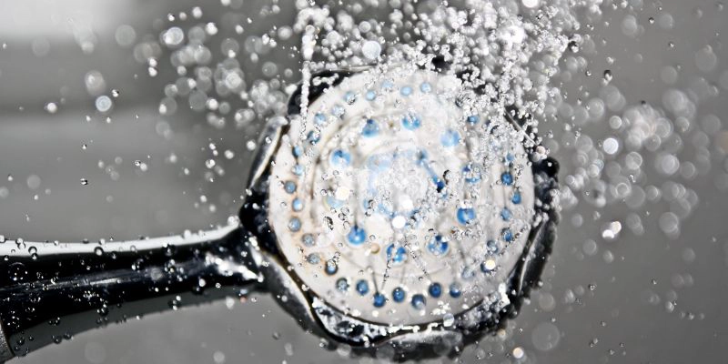 increase water pressure - Six Tips to Increase Water Pressure in Your Shower - shower head with water coming out