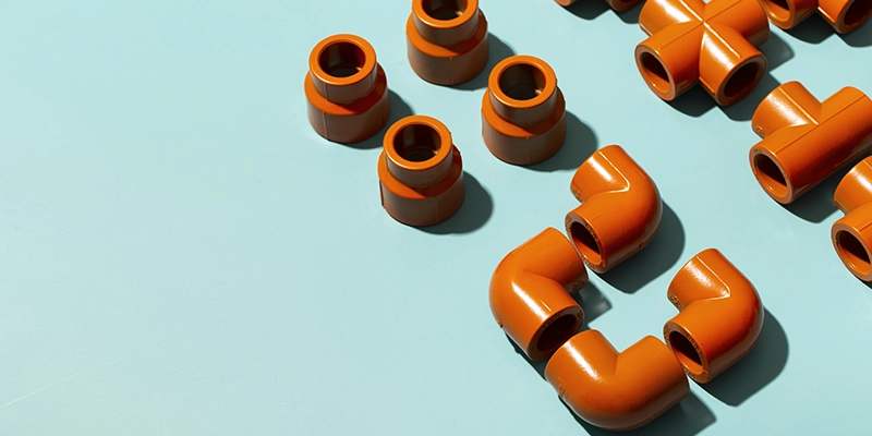drain cleaning - drain cleaning faq - various orange colored pvc parts