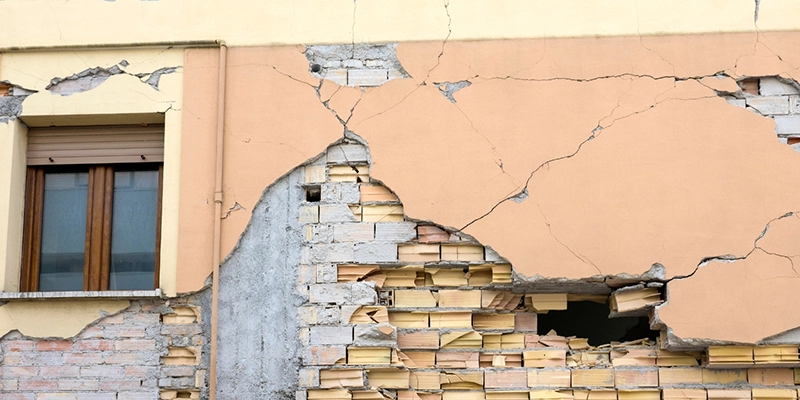slab leak - earthquakes cause slab leak - heavily damaged exterior wall