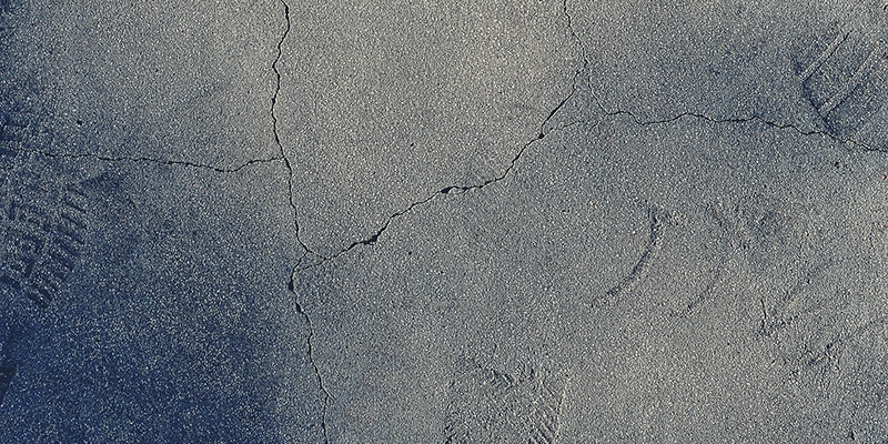 slab leak - Slab leak repairs - cracked dry cement with boot imprints