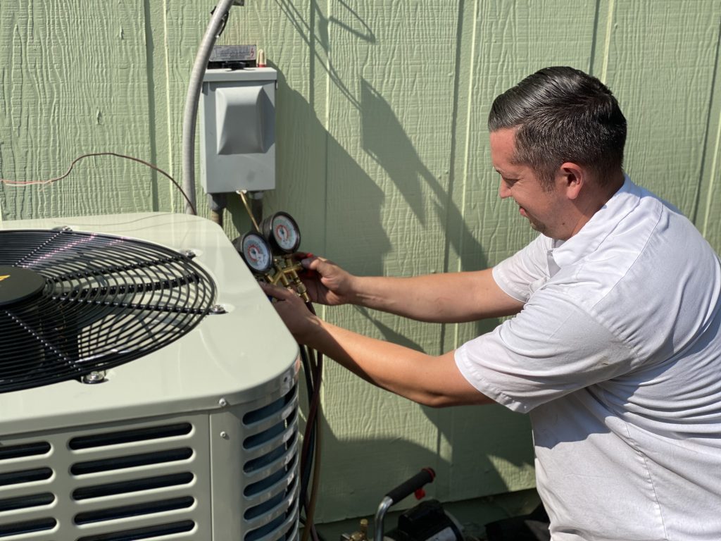 HVAC tech working